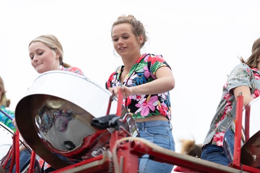 Holland, Michigan, USA - May 11, 2019: Tulip Time Parade, Members of the Petoskey Steel Drum Band, performing during the parade