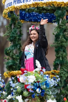 Holland, Michigan, USA - May 11, 2019: Tulip Time Parade, The Bravarian Princess and Court, riding on a float, smiling and waving at spectators