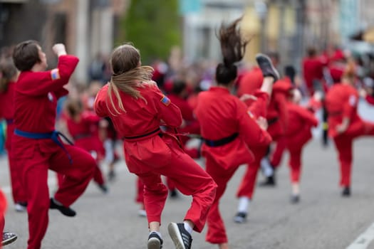 Holland, Michigan, USA - May 11, 2019: Tulip Time Parade, Display by school of martial arts on the street during the parade