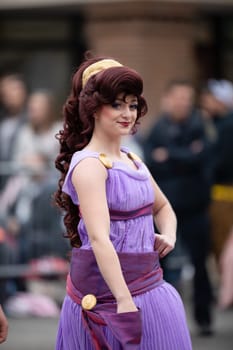 Holland, Michigan, USA - May 11, 2019: Tulip Time Parade, Woman dress up as Disney Character Megara during the parade