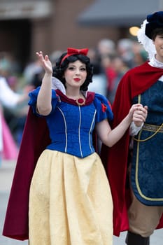 Holland, Michigan, USA - May 11, 2019: Tulip Time Parade, Woman dress up as Disney Character Snow White during the parade