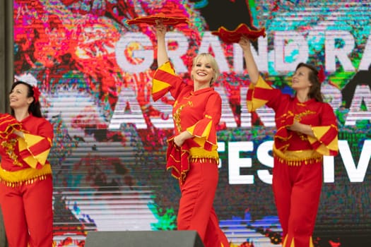 Grand Rapids, Michigan, USA - June 15, 2019: Asian Pacific Festival, Women wearing traditional chinese clothing, performing a display of traditional dances, at the Rosa Parks Circle