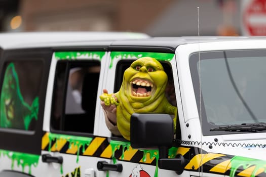 Holland, Michigan, USA - May 11, 2019: Tulip Time Parade, People dress up as Ghostbusters, promoting the Tulip City Ghostbusters during the parade