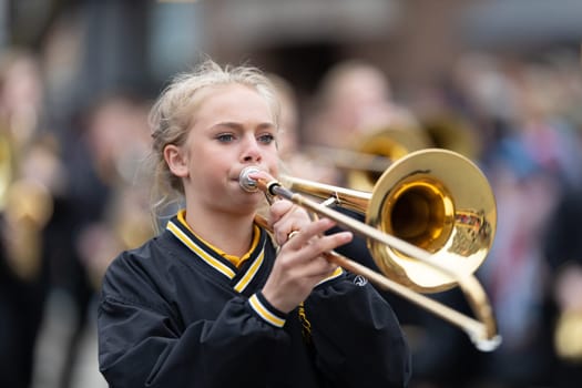 Holland, Michigan, USA - May 11, 2019: Tulip Time Parade, Members of the Hamilton Middle School marching band, performing during the parade