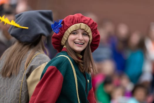 Holland, Michigan, USA - May 11, 2019: Tulip Time Parade, Group wearing Medieval Style Clothing, promoting the Dutch Winterfest in Holland, during the parade