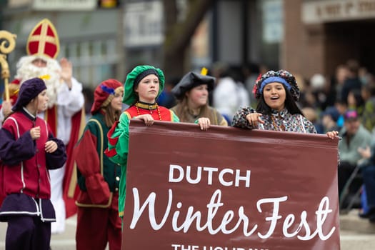 Holland, Michigan, USA - May 11, 2019: Tulip Time Parade, Group wearing Medieval Style Clothing, promoting the Dutch Winterfest in Holland, during the parade