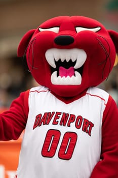 Holland, Michigan, USA - May 11, 2019: Tulip Time Parade, Pounce Panther, mascot of the Davenport University, going down the road during the parade
