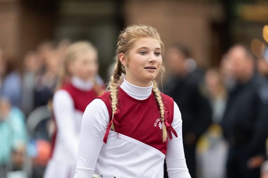 Holland, Michigan, USA - May 11, 2019: Tulip Time Parade, Members of the Holland Christian Middle School Band, standing stones, performing during the parade