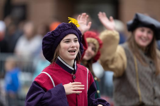 Holland, Michigan, USA - May 11, 2019: Tulip Time Parade, Group wearing Medieval Style Clothing, promoting the Dutch Winterfest in Holland, during the parade