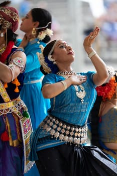 Columbus, Ohio, USA - May 26, 2019: Columbus Asian Festival, Franklin Park, Indian women in traditional clothing, performing traditional Indian dance.
