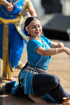 Columbus, Ohio, USA - May 26, 2019: Columbus Asian Festival, Franklin Park, Indian women in traditional clothing, performing traditional Indian dance.