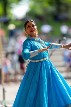 Columbus, Ohio, USA - May 26, 2019: Columbus Asian Festival, Franklin Park, Indian women in traditional clothing, performing traditional Indian dance.