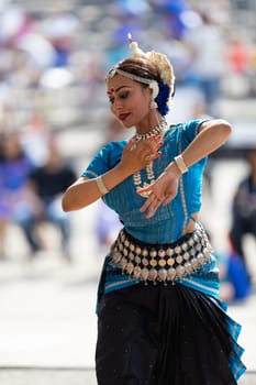 Columbus, Ohio, USA - May 26, 2019: Columbus Asian Festival, Franklin Park, Indian women in traditional clothing, performing traditional Indian dance.