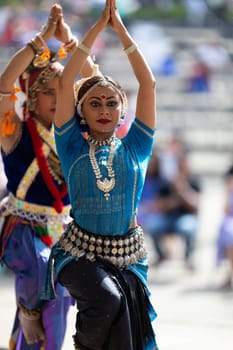 Columbus, Ohio, USA - May 26, 2019: Columbus Asian Festival, Franklin Park, Indian women in traditional clothing, performing traditional Indian dance.