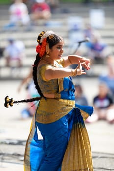 Columbus, Ohio, USA - May 26, 2019: Columbus Asian Festival, Franklin Park, Indian women in traditional clothing, performing traditional Indian dance.