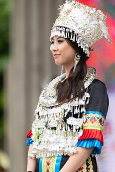 Grand Rapids, Michigan, USA - June 15, 2019: Asian Pacific Festival, hmong people wearing traditional clothing at a fashion display  in the Rosa Parks Circle