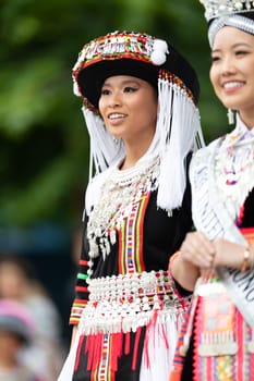 Grand Rapids, Michigan, USA - June 15, 2019: Asian Pacific Festival, hmong people wearing traditional clothing at a fashion display  in the Rosa Parks Circle