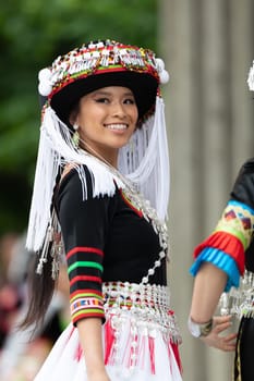 Grand Rapids, Michigan, USA - June 15, 2019: Asian Pacific Festival, hmong people wearing traditional clothing at a fashion display  in the Rosa Parks Circle