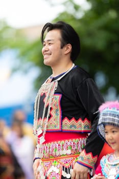 Grand Rapids, Michigan, USA - June 15, 2019: Asian Pacific Festival, hmong people wearing traditional clothing at a fashion display  in the Rosa Parks Circle