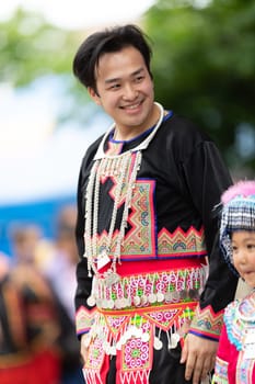 Grand Rapids, Michigan, USA - June 15, 2019: Asian Pacific Festival, hmong people wearing traditional clothing at a fashion display  in the Rosa Parks Circle
