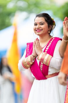 Grand Rapids, Michigan, USA - June 15, 2019: Asian Pacific Festival, indian woman wearing traditional clothing at a fashion display  in the Rosa Parks Circle