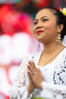 Grand Rapids, Michigan, USA - June 15, 2019: Asian Pacific Festival, indonesian woman wearing traditional clothing at a fashion display  in the Rosa Parks Circle