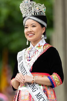 Grand Rapids, Michigan, USA - June 15, 2019: Asian Pacific Festival, hmong people wearing traditional clothing at a fashion display  in the Rosa Parks Circle