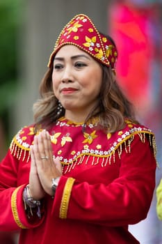 Grand Rapids, Michigan, USA - June 15, 2019: Asian Pacific Festival, indonesian woman wearing traditional clothing at a fashion display  in the Rosa Parks Circle