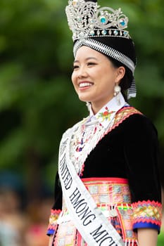Grand Rapids, Michigan, USA - June 15, 2019: Asian Pacific Festival, hmong people wearing traditional clothing at a fashion display  in the Rosa Parks Circle