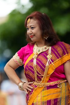Grand Rapids, Michigan, USA - June 15, 2019: Asian Pacific Festival, woman from blangladesh  wearing traditional clothing at a fashion display  in the Rosa Parks Circle