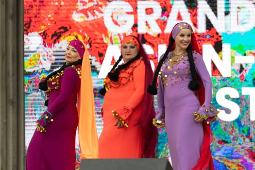Grand Rapids, Michigan, USA - June 15, 2019: Asian Pacific Festival, Women wearing traditional Egyptian clothing performing traditional dance at the Rosa Parks Circle