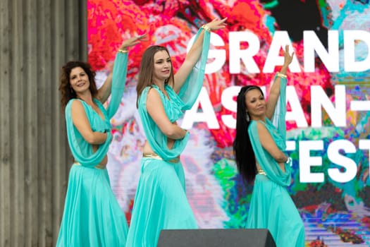 Grand Rapids, Michigan, USA - June 15, 2019: Asian Pacific Festival, Women wearing traditional Egyptian clothing performing traditional dance at the Rosa Parks Circle