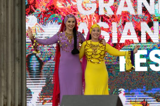 Grand Rapids, Michigan, USA - June 15, 2019: Asian Pacific Festival, Women wearing traditional Egyptian clothing performing traditional dance at the Rosa Parks Circle