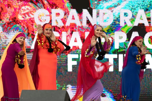Grand Rapids, Michigan, USA - June 15, 2019: Asian Pacific Festival, Women wearing traditional Egyptian clothing performing traditional dance at the Rosa Parks Circle