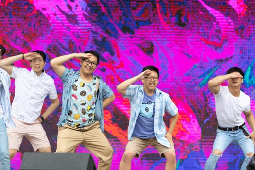 Grand Rapids, Michigan, USA - June 15, 2019: Young Men and Women, performing modern K-POP dance during the asian festival at Rosa Park