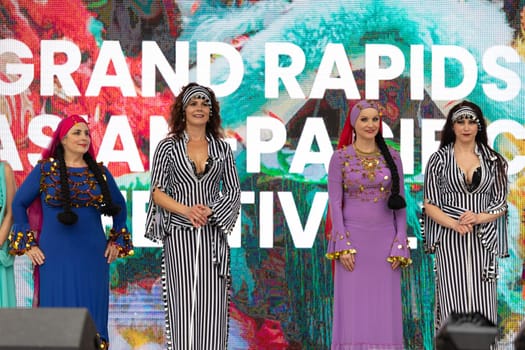 Grand Rapids, Michigan, USA - June 15, 2019: Asian Pacific Festival, Women wearing traditional Egyptian clothing performing traditional dance at the Rosa Parks Circle