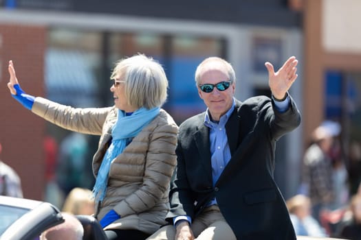 Benton Harbor, Michigan, USA - May 4, 2019: Blossomtime Festival Grand Floral Parade, Car Transporting St Joseph mayor Mike Garey