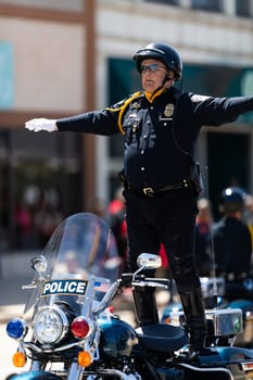 Benton Harbor, Michigan, USA - May 4, 2019: Blossomtime Festival Grand Floral Parade, Indianapolis police motorcycle drill team performing at the parade