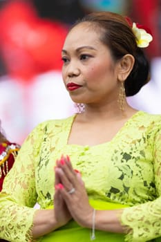 Grand Rapids, Michigan, USA - June 15, 2019: Asian Pacific Festival, indonesian woman wearing traditional clothing at a fashion display  in the Rosa Parks Circle