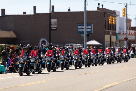 Benton Harbor, Michigan, USA - May 4, 2019: Blossomtime Festival Grand Floral Parade, Indianapolis police motorcycle drill team performing at the parade