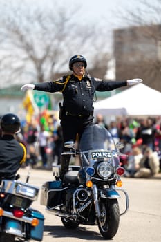 Benton Harbor, Michigan, USA - May 4, 2019: Blossomtime Festival Grand Floral Parade, Indianapolis police motorcycle drill team performing at the parade