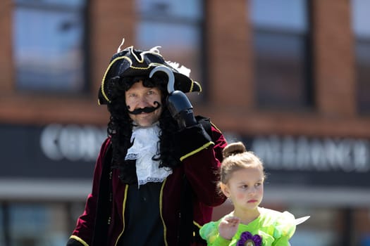 Benton Harbor, Michigan, USA - May 4, 2019: Blossomtime Festival Grand Floral Parade, Man dress up as Hook, going down the road during the parade