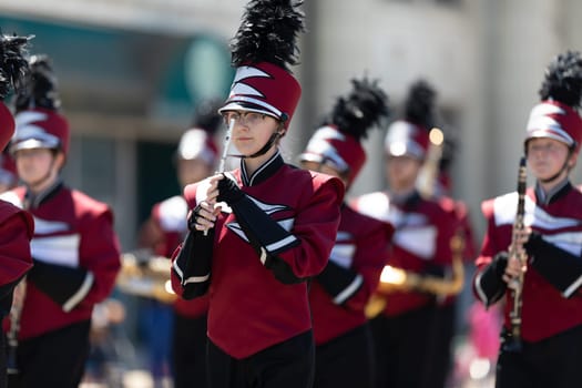 Benton Harbor, Michigan, USA - May 4, 2019: Blossomtime Festival Grand Floral Parade, Members of the Watervliet High School Marching Band performing at the parade