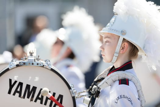 Benton Harbor, Michigan, USA - May 4, 2019: Blossomtime Festival Grand Floral Parade, Members of the Lakeshore Middle School Marching Band performing at the parade