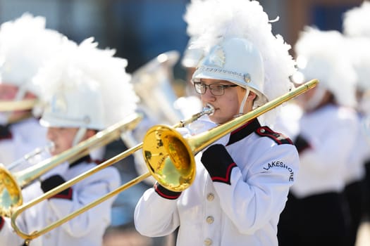Benton Harbor, Michigan, USA - May 4, 2019: Blossomtime Festival Grand Floral Parade, Members of the Lakeshore Middle School Marching Band performing at the parade