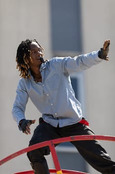 Benton Harbor, Michigan, USA - May 4, 2019: Blossomtime Festival Grand Floral Parade, Sam the wheeler riding a giant wheel at the parade