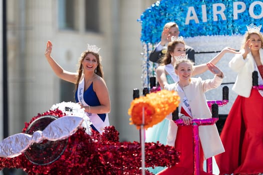 Benton Harbor, Michigan, USA - May 4, 2019: Blossomtime Festival Grand Floral Parade, float carrying Miss South Heaven and her court during the parade