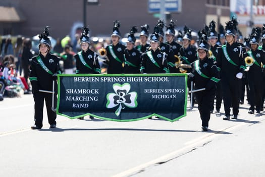 Benton Harbor, Michigan, USA - May 4, 2019: Blossomtime Festival Grand Floral Parade, Members of the Berrien Springs High School, performing during the parade