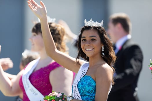 Benton Harbor, Michigan, USA - May 4, 2019: Blossomtime Festival Grand Floral Parade, Float Carrying Miss Watervliet and her Court