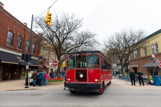 Holland, Michigan, USA - May 11, 2019: View Of the West 8th Street with a Trolley during the Tulip Time Festival